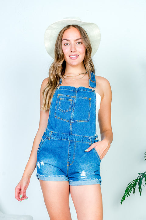 Denim Mini Short Overalls with Layered Front Bib Pocket, Distressed Detail, and Frayed Cuffed Hem in Medium Blue (3121RS) - Wholesale Fashion Couture 