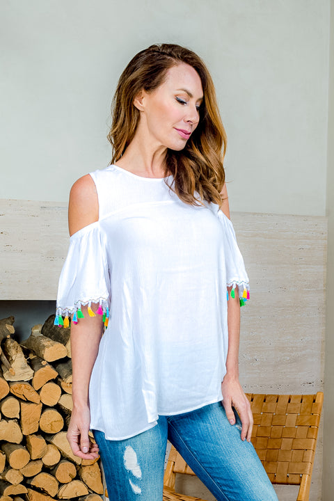 'Fiesta' Cold Shoulder Top with Ruffle Sleeve and Tassel Trim (SW181394) - Wholesale Fashion Couture 