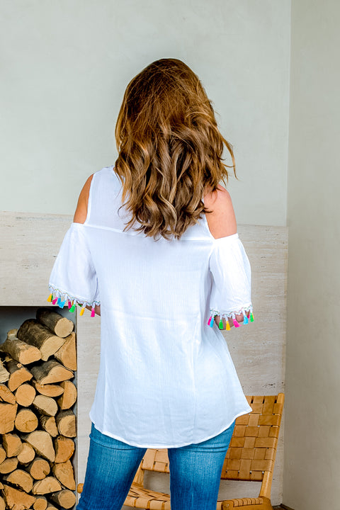 'Fiesta' Cold Shoulder Top with Ruffle Sleeve and Tassel Trim (SW181394) - Wholesale Fashion Couture 