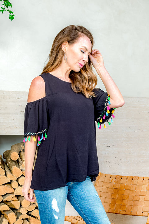 'Fiesta' Cold Shoulder Top with Ruffle Sleeve and Tassel Trim (SW181394) - Wholesale Fashion Couture 
