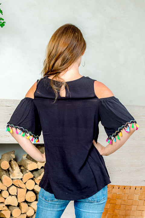 'Fiesta' Cold Shoulder Top with Ruffle Sleeve and Tassel Trim (SW181394) - Wholesale Fashion Couture 